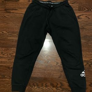 Adidas black joggers.